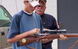 Student learns to safely work a bolt action firearm in a Department sponsored Hunter Education Course from New Mexico Department of Game and Fish.