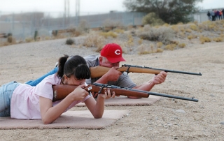 Students during New Mexico Department of Game and Fish field evaluation demonstrating the prone shooting position, the most steady of four positions.
